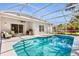 Inviting screened-in pool with patio, perfect for enjoying outdoor relaxation and entertainment at 10166 Hidden Dunes Ln, Orlando, FL 32832