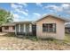 Exterior view of back of the home with enclosed sunroom at 1030 Blue Horizon Dr, Deltona, FL 32725