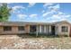 View of the home's backyard and enclosed sunroom at 1030 Blue Horizon Dr, Deltona, FL 32725
