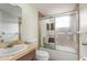 Bathroom featuring shower with glass door and sink with granite countertop at 1030 Blue Horizon Dr, Deltona, FL 32725