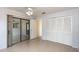 Bedroom with sliding door access to the patio, closet, and ceiling fan at 1030 Blue Horizon Dr, Deltona, FL 32725