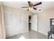 Bedroom featuring large closet, neutral walls, and ceiling fan at 1030 Blue Horizon Dr, Deltona, FL 32725