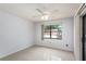Bedroom with a window overlooking the backyard, and ceiling fan at 1030 Blue Horizon Dr, Deltona, FL 32725