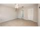 Neutral bedroom with a large window, closet, and ceiling fan at 1030 Blue Horizon Dr, Deltona, FL 32725