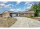 Charming single-story brick home with attached garage and curved driveway at 1030 Blue Horizon Dr, Deltona, FL 32725