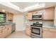 A modern kitchen features stainless steel appliances and updated countertops at 1030 Blue Horizon Dr, Deltona, FL 32725