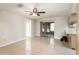 Large living room with sliding glass doors and access to the kitchen at 1030 Blue Horizon Dr, Deltona, FL 32725