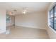 Open-concept living room with tile flooring, fan and natural lighting at 1030 Blue Horizon Dr, Deltona, FL 32725