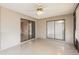 Bright sunroom features tile flooring, sliding glass doors, and a ceiling fan at 1030 Blue Horizon Dr, Deltona, FL 32725