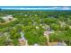 Expansive aerial view of a lush, tree-filled neighborhood under a bright blue sky at 105 Elizabeth Ave, Altamonte Springs, FL 32701