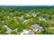 An aerial view displays the property's backyard, swimming pool, deck, and landscaping in a quiet residential neighborhood at 105 Elizabeth Ave, Altamonte Springs, FL 32701
