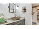 Charming bathroom with stone sink and rustic decorative shelves at 105 Elizabeth Ave, Altamonte Springs, FL 32701