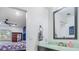 A stylish bathroom is adjacent to the bedroom, providing convenience and privacy at 105 Elizabeth Ave, Altamonte Springs, FL 32701
