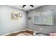 Neutral bedroom offers natural light through window and hardwood floors at 105 Elizabeth Ave, Altamonte Springs, FL 32701