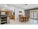 Inviting dining room featuring tile flooring, natural lighting, and seamless flow to kitchen and pool at 105 Elizabeth Ave, Altamonte Springs, FL 32701