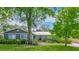 Charming single-story home with a metal roof, lush landscaping and inviting curb appeal at 105 Elizabeth Ave, Altamonte Springs, FL 32701