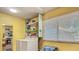 Bright laundry room features large window and washer and dryer at 105 Elizabeth Ave, Altamonte Springs, FL 32701