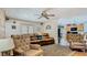 Open living room featuring hardwood floors, comfortable furniture and sliding glass doors to the back at 105 Elizabeth Ave, Altamonte Springs, FL 32701