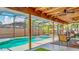 Screened patio with ceiling fan overlooks the pool and yard at 105 Elizabeth Ave, Altamonte Springs, FL 32701