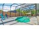 Relax in the screened pool area, complete with refreshing clear water, fun toys, and lounge chairs at 105 Elizabeth Ave, Altamonte Springs, FL 32701