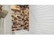 Beautiful shower with decorative tile and built-in shelving at 105 Elizabeth Ave, Altamonte Springs, FL 32701