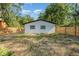 Fenced backyard offers lawn, shade trees, and privacy at 120 East St, Altamonte Springs, FL 32701