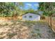 Fenced backyard offers lawn, shade trees, and privacy at 120 East St, Altamonte Springs, FL 32701
