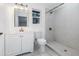 Bright bathroom offers vanity with modern fixtures and a tiled stand up shower at 120 East St, Altamonte Springs, FL 32701