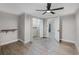 Bright bedroom features wood-look floors, neutral walls, closet, ceiling fan, and natural light at 120 East St, Altamonte Springs, FL 32701