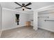 Bedroom features wood-look floors, neutral walls, ceiling fan, and closet with shelves at 120 East St, Altamonte Springs, FL 32701