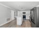 Bright kitchen with stainless steel appliances, white cabinets, and a convenient island at 120 East St, Altamonte Springs, FL 32701