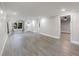 A spacious living room has hardwood floors and a calming neutral palette at 120 East St, Altamonte Springs, FL 32701