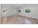 Spacious and airy bedroom with hardwood floors, natural light, and an ensuite bathroom at 120 East St, Altamonte Springs, FL 32701