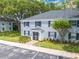 Lovely blue brick building with lush green surroundings and a well-maintained exterior at 130 Lewfield Cir # 130, Winter Park, FL 32792