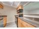 Efficient kitchen features modern appliances and wood cabinets, perfect for any home chef at 130 Lewfield Cir # 130, Winter Park, FL 32792