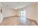 Bright living room with sliding glass doors, offering ample natural light and seamless outdoor access at 130 Lewfield Cir # 130, Winter Park, FL 32792