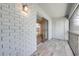 Screened-in patio with white brick walls and sliding glass doors leading inside at 130 Lewfield Cir # 130, Winter Park, FL 32792