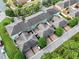 Elevated perspective of townhouse exteriors with brick driveways and green landscaping in a Gathering-friendly neighborhood at 14743 Driftwater Dr, Winter Garden, FL 34787