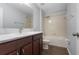 Bathroom showcasing a modern vanity with white countertop and a shower-tub combination at 14743 Driftwater Dr, Winter Garden, FL 34787