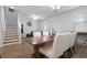 Open-concept living and dining areas showcase a modern aesthetic with sleek furniture at 14743 Driftwater Dr, Winter Garden, FL 34787