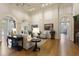 Spacious lobby featuring hardwood floors, grand decor, and a view into the fitness area at 14743 Driftwater Dr, Winter Garden, FL 34787