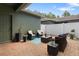 Private outdoor patio featuring stylish furniture, potted plants, and a brick paved area at 14743 Driftwater Dr, Winter Garden, FL 34787