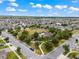 Aerial view of community pool and green space surrounded by homes at 1706 Leatherback Ln, St Cloud, FL 34771