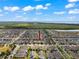 Expansive aerial view of a neighborhood with scenic water views at 1706 Leatherback Ln, St Cloud, FL 34771