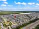 Community aerial view of residential area with lake at 1706 Leatherback Ln, St Cloud, FL 34771