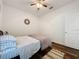 Bedroom with wood floors, a single bed, and a rug at 1706 Leatherback Ln, St Cloud, FL 34771
