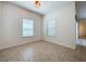 Bright dining room featuring neutral tile flooring and two windows letting in natural light at 1706 Leatherback Ln, St Cloud, FL 34771