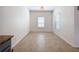 Bright dining room featuring neutral tile flooring and a view of the kitchen at 1706 Leatherback Ln, St Cloud, FL 34771