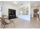 Bright foyer features decorative furniture, tiled floors, and easy access to the dining room and other areas of the home at 1706 Leatherback Ln, St Cloud, FL 34771