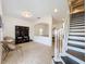 View of the foyer featuring stairs, custom furniture, and easy access to the rest of the beautiful home at 1706 Leatherback Ln, St Cloud, FL 34771